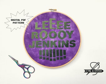 May include: A purple embroidery hoop with a cross-stitch design that reads "Leee Roooy Jenkins!!!" in green lettering.