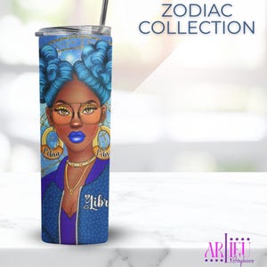 May include: A blue tumbler from the Zodiac Collection, featuring a Libra design. The illustration shows a woman with blue hair, gold glasses, and Libra earrings. The tumbler includes a silver straw and lid.