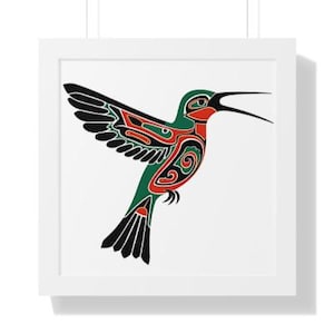 May include: A framed print featuring a stylized hummingbird design. The bird is depicted with black, green, and red tribal-inspired patterns. The artwork is set against a white background and enclosed in a white frame, creating a clean and modern aesthetic.