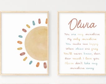 May include: Two printable wall art prints with a watercolor sun and a poem about sunshine. The poem reads "Olivia, You are my sunshine, My only sunshine, You make me happy, When skies are gray, You'll never know, dear, How much I love you, Please don't take my sunshine away."