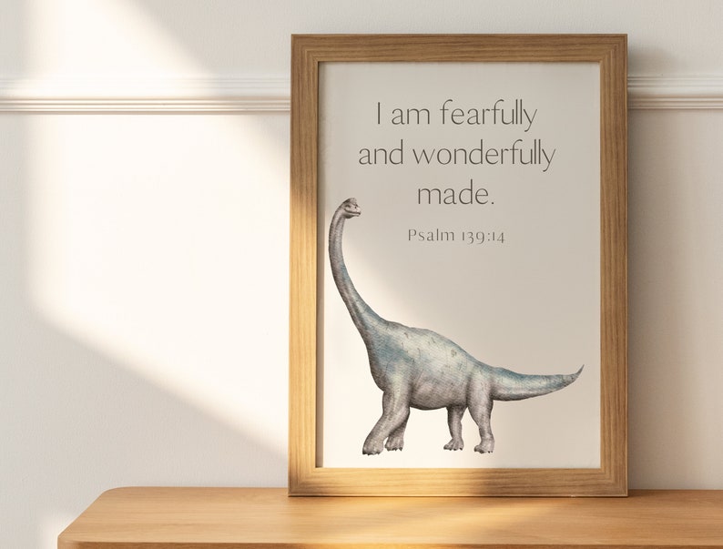 May include: A framed print with a watercolor illustration of a gray dinosaur with a long neck. The print has the text "I am fearfully and wonderfully made. Psalm 139:14"