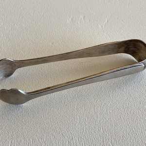 Vintage sugar thongs in silver metal
