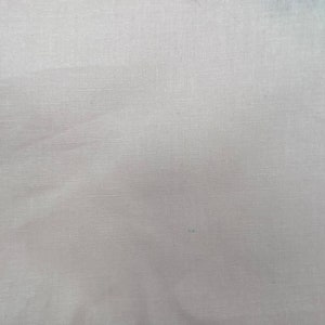 May include: A plain white fabric with a subtle woven texture.