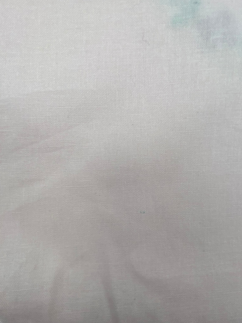 May include: A plain white fabric with a subtle woven texture.