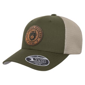 May include: An olive green baseball cap with a tan mesh back and a circular brown leather patch on the front. The patch features a graphic of a monkey wearing a hat and the text THE LEATHER PATCH.COM HAT CO. A sticker on the brim reads FLEXFIT TECH 110.