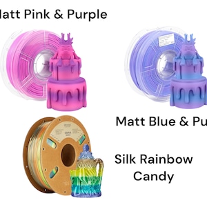 May include: Three spools of filament for 3D printing. The first spool is pink and purple, the second is blue and purple, and the third is a rainbow color. Each spool is labeled with the filament type and color.