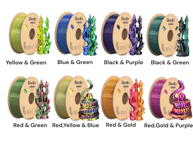 May include: Six spools of filament for 3D printing, each with a different color combination. The filament is wound around a cardboard spool with the text "GRATKIT" printed on it. The colors are yellow and green, blue and green, black and purple, black and green, red and green, red, yellow and blue, red and gold, and red, gold and purple.