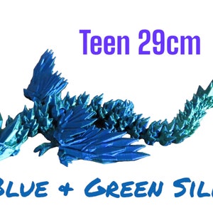 May include: Blue and green origami dragon sculpture, 29 inches long.  "Teen 29cm" and "BLUE + GREEN SILK" are written in the image.