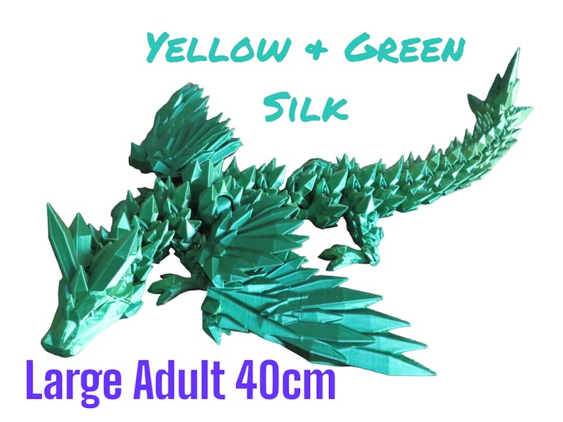 May include: A large, green, origami dragon made of silk. The dragon is 40 cm long and has a spiky, textured design. The text "YELLOW + GREEN SILK" and "Large Adult 40cm" is visible in the image.