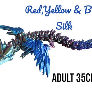 May include: Red, yellow, and blue origami dragon made of silk. The dragon is 35 inches long and has iridescent scales. ADULT 35CM.