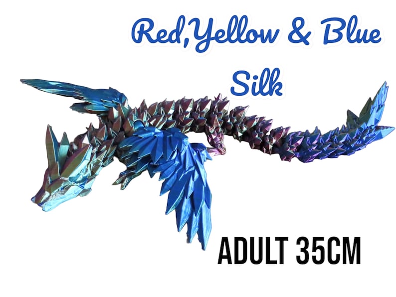 May include: Red, yellow, and blue origami dragon made of silk. The dragon is 35 inches long and has iridescent scales. ADULT 35CM.