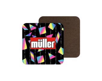 May include: A square drink coaster featuring a black background with vertical glittery stripes and colorful geometric shapes in shades of pink, blue, and yellow. A red rectangular box in the center contains the white text müller.