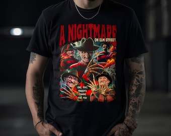 May include: A black t-shirt with a graphic print of Freddy Krueger from the movie "A Nightmare on Elm Street". The graphic features multiple images of Freddy Krueger with the text "One, Two, Freddy's Coming For You".
