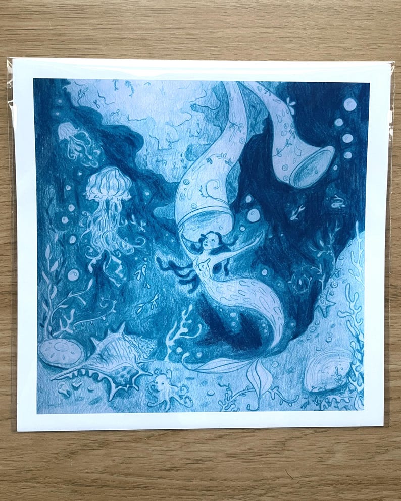 May include: A blue-toned illustration of a mermaid swimming underwater, surrounded by marine life. The artwork features a mermaid with flowing hair, jellyfish, seashells, and coral. The image is a pencil drawing style.