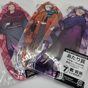May include: Three colourful acrylic keychains featuring anime characters from the Tokyo Revengers series. Each keychain has a stained glass design and features a different character. The text on the packaging reads "Atari?! Promaid" and "Atari Prize" in Japanese.