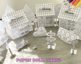 May include: A printable paper doll house set with a green grocer, bakery, flower shop, bus, car, bicycle, and traffic signs. The set is black and white and ready to be colored.