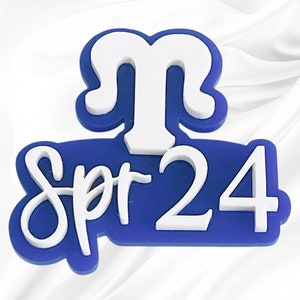 May include: Blue and white plastic sticker with the text "Spr-24" and a white stylized letter "M" above the text.