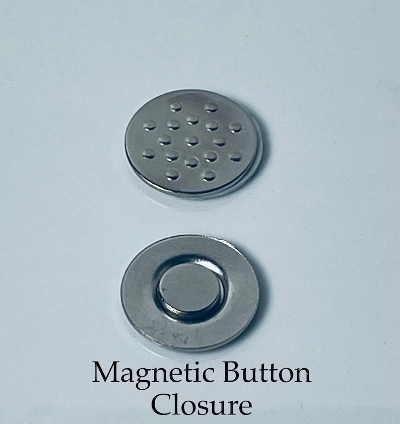 May include: Two silver magnetic button closures. One closure has a flat surface with a pattern of small circles. The other closure has a recessed center with a round magnet.