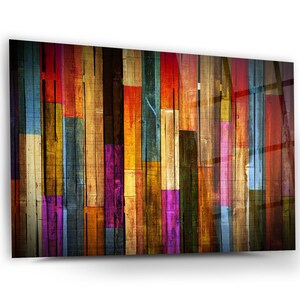 May include: Abstract art print featuring a colourful pattern of vertical wooden planks in shades of red, orange, yellow, green, blue, purple, and brown.