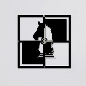 May include: Black and white wall clock with a chess knight design. The clock is made of metal and has a square shape.