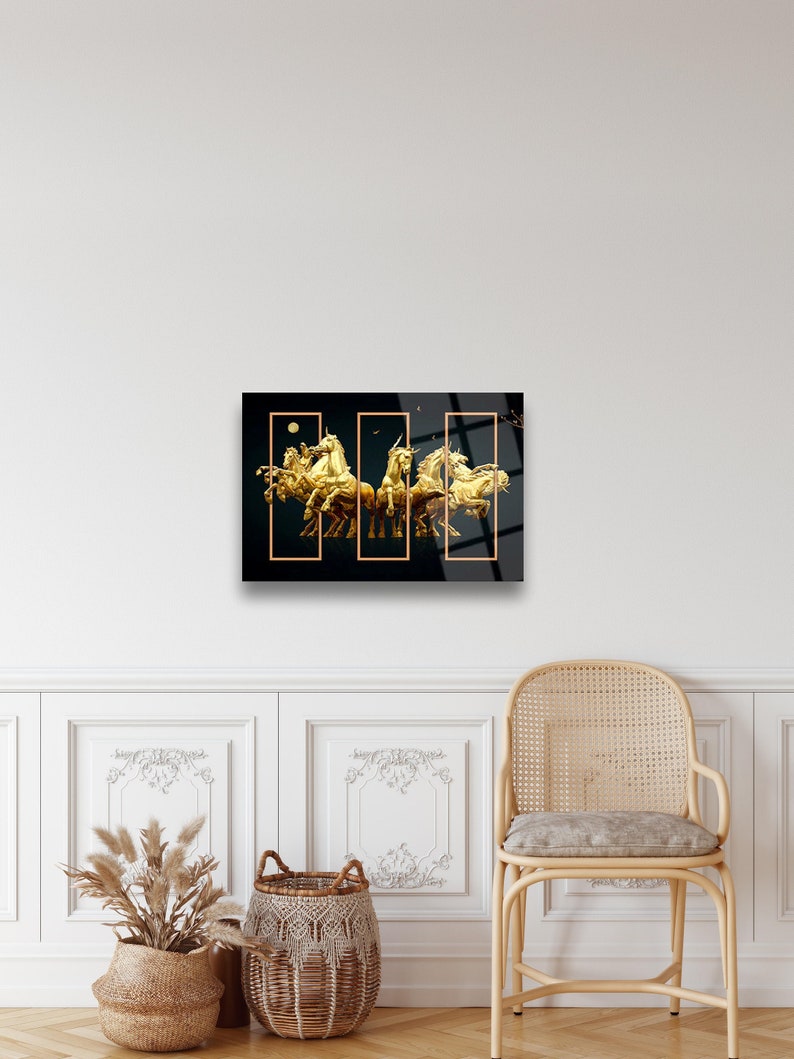 May include: A black and gold abstract art print featuring a group of golden horses in a dynamic pose. The horses are arranged in a circular formation, creating a sense of movement and energy. The print is divided into three sections, each with a different perspective of the horses.