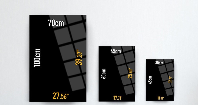 May include: Three black framed mirrors with grid patterns and measurements in inches and centimeters. The largest mirror is 39.37 inches by 27.56 inches, the middle mirror is 25.60 inches by 17.7 inches, and the smallest mirror is 17.7 inches by 11.8 inches.