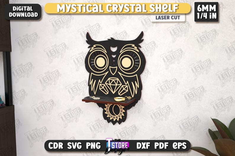 May include: A laser-cut, black owl-shaped crystal shelf with gold accents, featuring a shelf for displaying small items. The design includes the text "MYSTICAL CRYSTAL SHELF" and "LASER CUT". The shelf is 1/4 inch (6mm) thick.