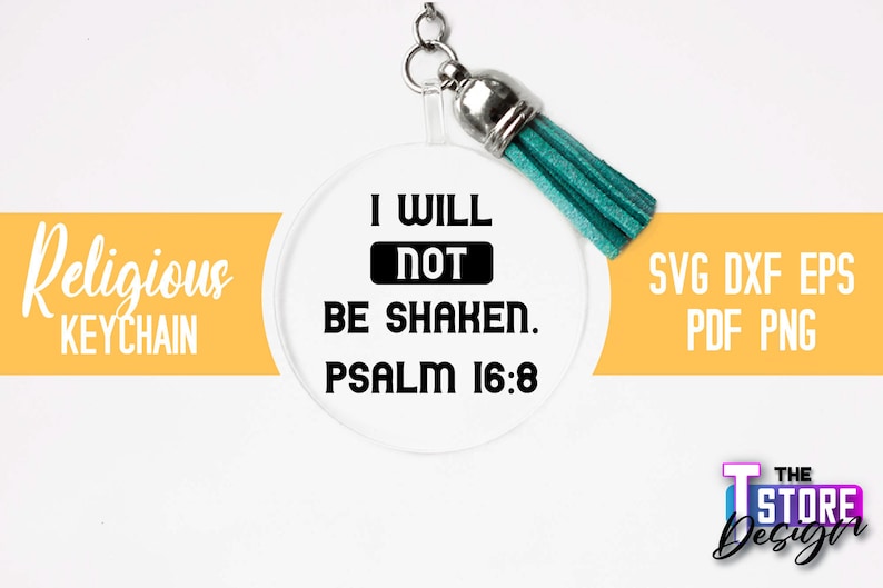 Pu&ograve; includere: Un portachiavi rotondo e trasparente con un design in bianco e nero che recita "I WILL NOT BE SHAKEN. PSALM 16:8". Il portachiavi ha un pon pon turchese.