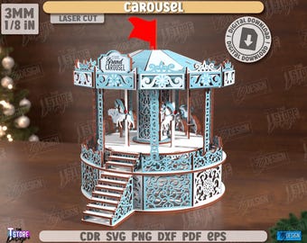 May include: A laser-cut wooden carousel model with a light blue and brown color scheme. The carousel features intricate details, including horses, decorative panels, and a red flag. The text "The Grand Carousel" is visible. The model is 3mm or 1/8 in thick.