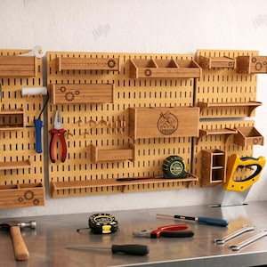 May include: Wooden pegboard with various tools and storage shelves. Includes a hammer, tape measure, screwdrivers, pliers, and a saw. The pegboard has a gear design and the text "The Store Design".