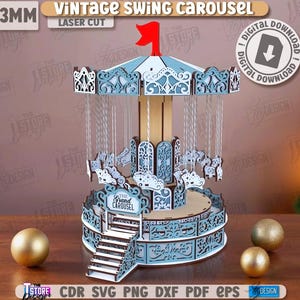 Könnte beinhalten: Ein lasergeschnittenes Holzkarussellmodell in Hellblau und Weiß. Das Karussell weist aufwendige Details wie Pferde und dekorative Muster auf. Der Text "VINTAGE SWING CAROUSEL" ist sichtbar. Das Modell ist 3 mm dick.