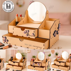 Könnte beinhalten: Ein hölzerner Make-up-Organizer mit rundem Spiegel, Schubladen und Fächern. Der Organizer ist mit floralen Akzenten und dem Satz "YOU ARE amazing" verziert. Das Design umfasst eine Vielzahl von schnittfertigen Dateiformaten.