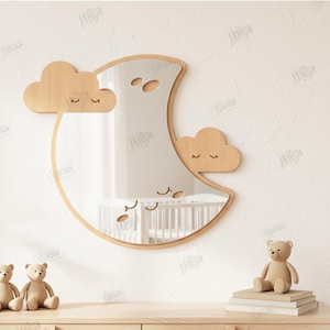 May include: A wooden moon-shaped mirror with two cloud accents. The mirror has a light wood frame and features a sleeping face design. Two teddy bears sit on a wooden surface below the mirror. The image also includes text that says "CUT READY FILE".