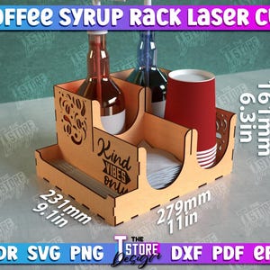 May include: Laser cut wooden syrup rack with two bottle holders, a napkin holder, and a cup holder. The rack is 9.1 inches wide, 11 inches long, and 6.3 inches tall. It has the words "Kind Vibes Only" printed on the side.