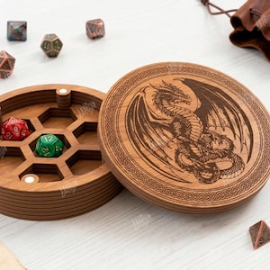 May include: Wooden dice box with a laser-etched dragon design on the lid. The box is open, revealing a honeycomb interior with two dice inside. Several other dice of various colors and shapes are scattered around the box. The text "CUT READY FILE DIGITAL DOWNLOAD" is visible.