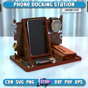 Op de afbeelding: Lasergesneden houten telefoonhouder met vakken voor een telefoon, horloge en andere accessoires. De houder is 6 mm (1/4 inch) dik en heeft een donkerhouten afwerking.