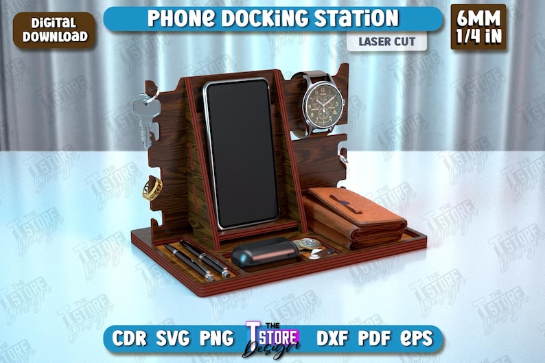 Op de afbeelding: Lasergesneden houten telefoonhouder met vakken voor een telefoon, horloge en andere accessoires. De houder is 6 mm (1/4 inch) dik en heeft een donkerhouten afwerking.
