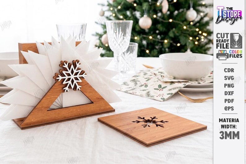 May include: A triangular wooden napkin holder featuring a white snowflake cutout and a matching square wooden coaster with a snowflake cutout. The set is crafted from 3mm thick material, designed for holiday table settings with white napkins.
