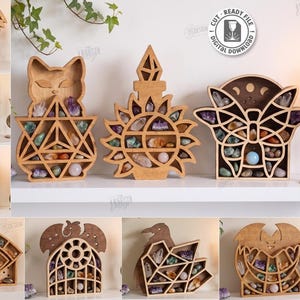 May include: A collection of ten laser-cut wooden display shelves in various shapes including a cat, sun, butterfly, mushroom, eye, and raven. Each shelf features intricate geometric compartments filled with assorted colorful crystals and stones.