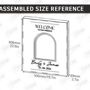 May include: A rectangular wedding sign with an arched cutout, featuring the text "WELCOME TO OUR WEDDING", names, and a date. Dimensions are 23.9 inches high, 19.7 inches wide, and 2.7 inches thick.