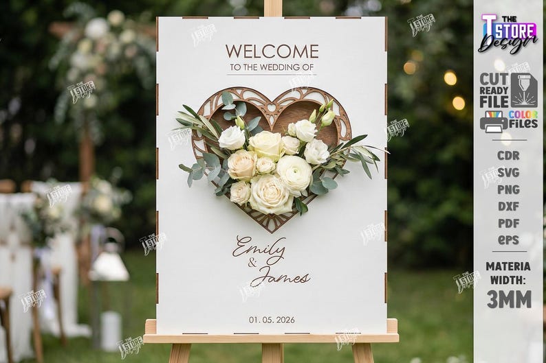 May include: A white wedding welcome sign on an easel. The sign features a wooden heart-shaped design with a floral arrangement of white and cream roses, greenery, and the names "Emily & James" with the date 01.05.2026.