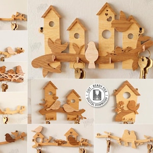 Op de afbeelding: Een verzameling houten sleutelhangers in verschillende ontwerpen, met vogelhuisjes, vogels en takken. De sleutelhangers zijn lasergesneden en klaar voor digitale download. De materiaalbreedte is 3 mm.