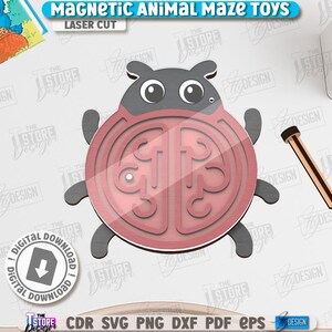 May include: A laser-cut magnetic animal maze toy in the shape of a ladybug. The ladybug is red and gray with a clear plastic top. A wooden stylus is included. The text "MAGNETIC ANIMAL MAZE TOYS" and "LASER CUT" are visible.