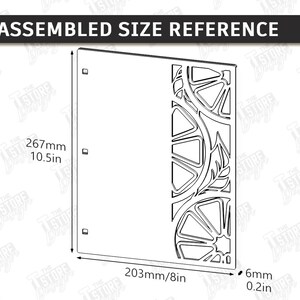 May include: A laser-cut panel with a citrus fruit design, measuring 10.5 inches high, 8 inches wide, and 0.2 inches thick. The design includes orange slices and leaves. The text "ASSEMBLED SIZE REFERENCE" is at the top.