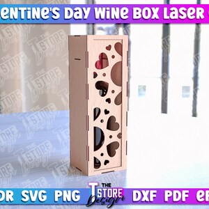 May include: A laser cut wooden wine box with a heart design. The box is made of 3mm thick wood and is designed to hold a standard size wine bottle. The box is perfect for Valentine's Day or any other special occasion.