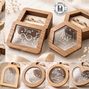May include: A collection of ten wooden ring boxes in various shapes including square, hexagonal, circular, and heart-like designs. Each box features a clear acrylic lid engraved with custom text, dates, and floral or geometric patterns.