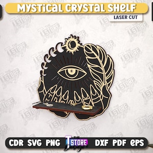 May include: Black laser-cut wooden shelf with a mystical design. The shelf features an eye, sun, moon, feather, and hands. It is 1/4 inch thick and includes a small shelf to hold crystals or jewelry. The text "MYSTICAL CRYSTAL SHELF" is at the top.
