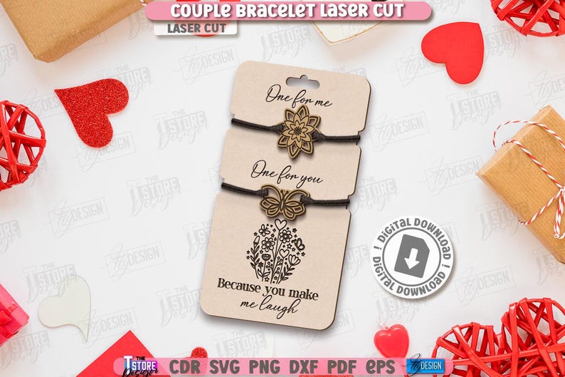K&ouml;nnte beinhalten: Paararmb&auml;nder, lasergeschnitten, auf einer beigen Karte mit den Texten "One for me" und "One for you". Die untere Karte tr&auml;gt die Aufschrift "Because you make me laugh". Rote Herzdekorationen sind ebenfalls zu sehen.