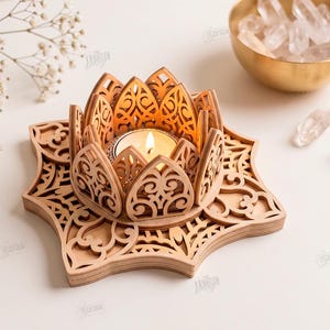May include: A light-colored wooden lotus flower candle holder with intricate laser-cut patterns. The base is star-shaped with detailed cutouts. A small lit tea light candle sits in the center. Text on the right reads: CUT READY FILE DIGITAL DOWNLOAD CDR SVG PNG DXF PDF EPS COMPATIBLE WITH ANY MATERIAL THICKNESS.