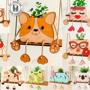 May include: A selection of ten laser-cut wooden planters, each in a different animal or character design, hanging from a swing. The planters include features such as glasses and animal faces, and each holds a small plant.